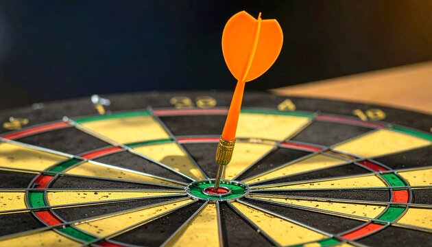 "A symbolic success artwork showing a dartboard with alternating yellow and black sections and a central red and green bullseye. A single orange dart is precisely lodged in the bullseye, representing 