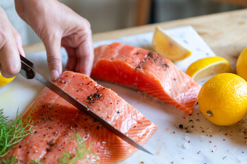 Fresh salmon preparation scene.