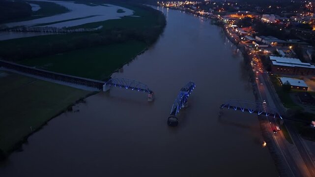 Aerial overhead footage of a train trestle at night on the Cumberland River in Clarksville, TN
