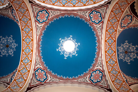 Sarajevo, Bosnia and Herzegovina - 07 May 2025: View of a mesmerizing ceiling adorned with intricate patterns, where vibrant blues meet warm oranges and reds in a symphony of artistic expression.