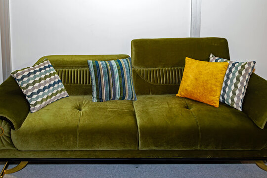 Retro textile upholstery couch with decorative colorful pillows pile
