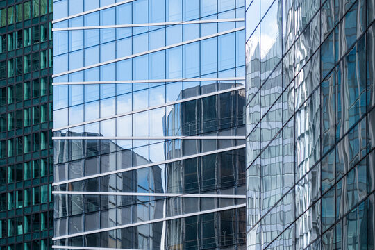 Modern corporate office architecture in urban glass facade reflection with grid angles and clean lines for professional business background