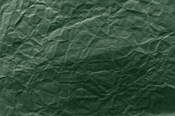 Naklejka premium Textured green crumpled paper background