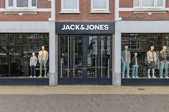Zaandam, Netherlands, April 11, 2026. Exterior view of a Jack & Jones retail shop with fashion mannequins displayed in the large windows.