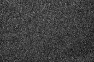 Fototapeta premium Dark gray fabric background with a textured, woven style. The background is gray, adding a subtle, sophisticated look. Simple dark gray textured background with copy space.