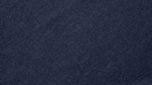 Dark gray fabric background with a textured, woven style. The background is a deep gray, adding a subtle, sophisticated texture. Blue textured desktop wallpaper with copy space.