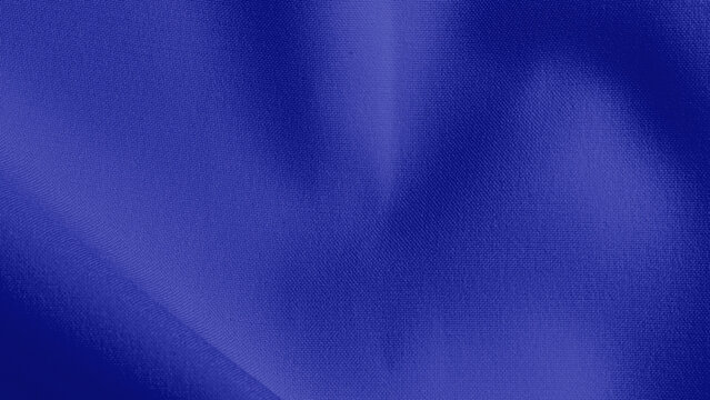 Blue background with a smooth, silky texture. The background features a rich blue color, creating a calming and elegant style. Blue textured desktop wallpaper with copy space.