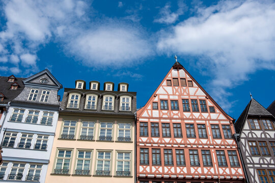 Timber facade architecture on Frankfurt romerberg town square with heritage landmark character in Germany and traditional houses against blue sky