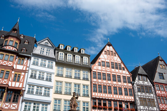 Colorful fachwerk facade architecture in Frankfurt romerberg town with heritage travel appeal under wide sky in Germany with historic houses