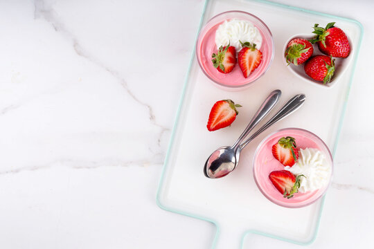 Delicious strawberry mousse parfait with whipped cream or yogurt topping and fresh strawberries, high protein healthy dessert idea