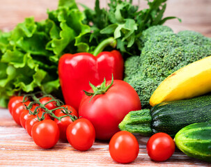 Assorted farm vegetables on rustic wooden table. Local harvest, seasonal produce, agriculture and...