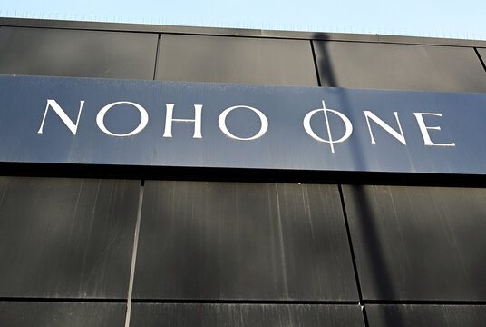 Wola, Warsaw, Poland, Europe - 03.2026 : NOHO ONE - luxury apartment complex developed by NOHO Investment, logo of developer on the fence of construction site, Karolkowa street