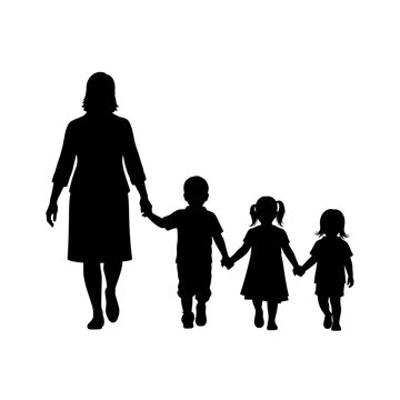 Woman walking with three small children.