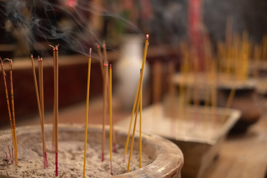 incense sticks burning in a temple