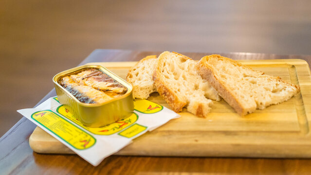 Pinhais sardines factory, open sardine tin with rustic bread for degustation in interactive museum, Matosinhos city near Porto, Portugal, 8th April 2026.
