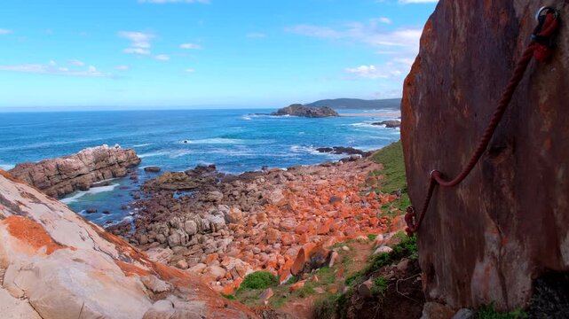 Mounted guide ropes down side of big boulder on Robberg Nature Reserve trail