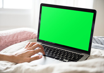 Fototapeta premium Laptop with green screen display, suitable as mockup