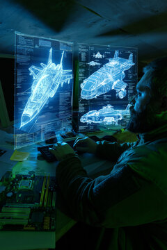 Military engineer analyzing aircraft hologram blueprint advanced defense systems. Concept of aerospace engineering, strategic development and high tech military design.