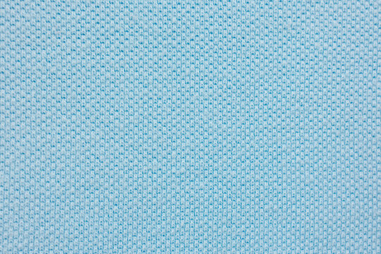 Light blue pique knit fabric texture for polo shirts with breathable cotton weave pattern background