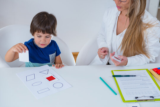 Child psychology, toddler doing logic tests with cards