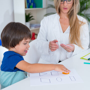 Child psychology, toddler doing logic tests with cards