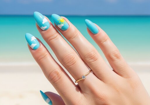 Hand with painted nails and ring on finger at the beach with ocean background