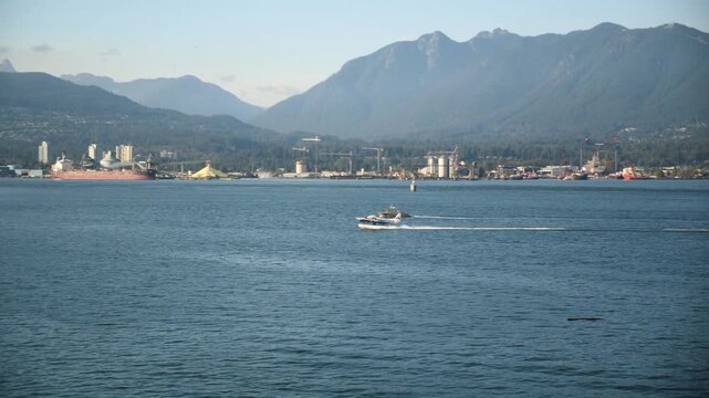 Seaplane landing near floating marine gas station in Vancouver Harbour, British Columbia, Canada. 4k footage