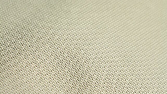 Close-up of soft beige linen fabric. Texture of fabric. High quality 4k footage