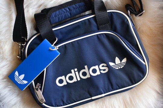 the Adidas logo on a mini airliner bag 