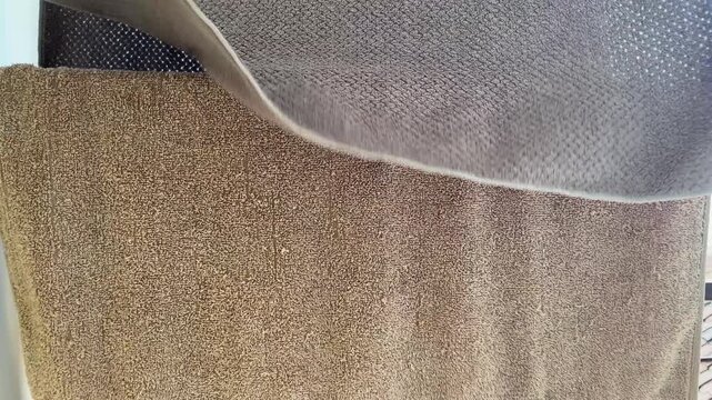 High Angle View of Various Carpet Fabric Texture Samples in Neutral Earth Tones