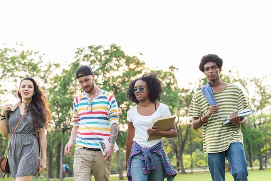 Diverse students walking together outdoors