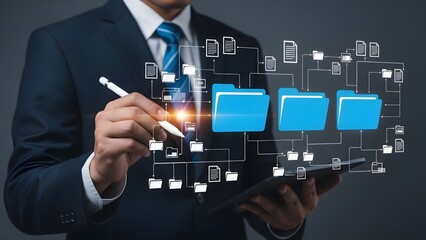Fototapeta premium Businessman in a suit uses a stylus to manage holographic folders and data on a tablet.