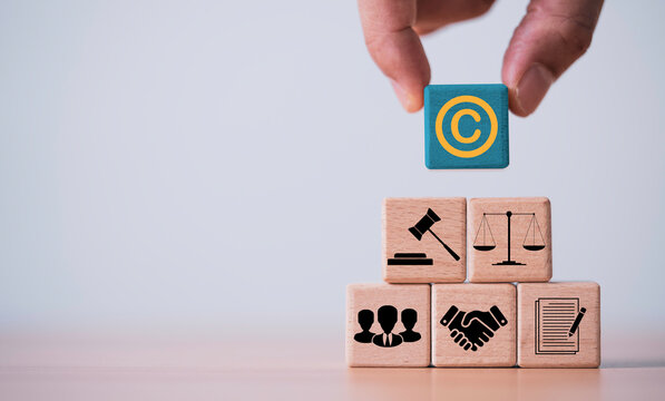 Copyright protection and legal compliance concept with intellectual property symbol, contract agreement, justice scale, and business partnership, represent legal rights management, licensing.