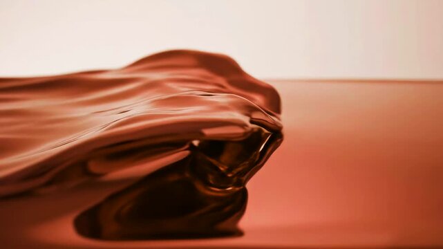 A close-up shot of a thick, viscous liquid with a metallic copper or bronze sheen flowing smoothly. Rich abstract texture resembling molten metal or heavy satin with soft highlights and deep, warm sha