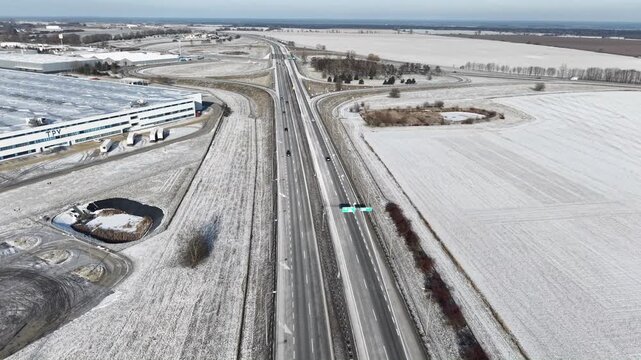 Aerial drone view of S3 expressway in eastern Poland covered in snow. Gorz&oacute;w Wielkopolski