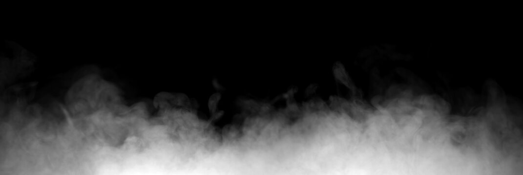 White fog and smoke rising from the bottom on a black background, creating an atmospheric mist texture ideal for visual effects, cinematic scenes, overlays, graphic design.
