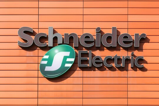Grenoble, France - June 24, 2017: Schneider Electric logo on a wall. Schneider Electric is a European multinational corporation, leader in automation and electricity management