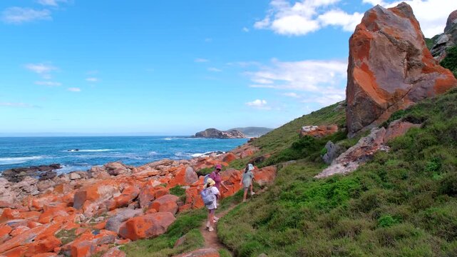 Mom with girls hiking circular trail of Robberg Nature Reserve, Garden Route