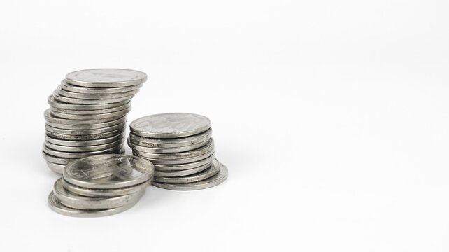 Silver coins stacks isolated on a white background. Indonesian rupiah coin. 1000 rupiah coin