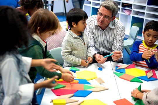 Children learning with geometric shapes.