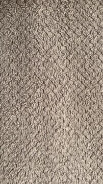 Close-up of Soft Grey Microfiber Fabric Texture with Detailed Fiber Patterns
