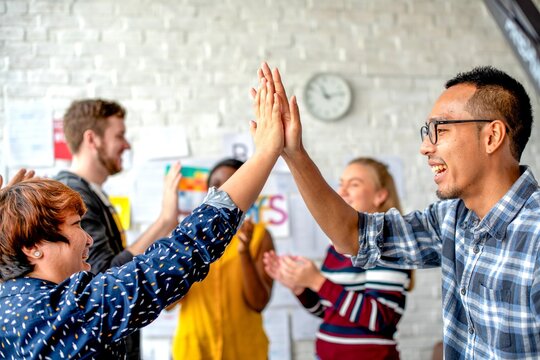 Diverse team celebrating success.
