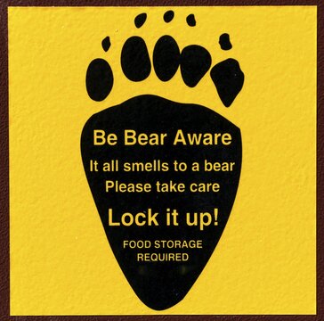 Be Bear Aware, Warning sign on a bear-proof dustbin, Grand Teton National Park, Wyoming, USA