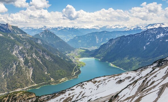 View of Lake Achen and snowy main chain of the Alps, spring, Tyrol, Austria