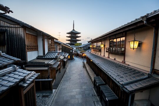 Yasaka dori historic street in the old town with traditional Japanese houses, five-story Yasaka Pagoda of the Buddhist Hōkanji Temple at the back, evening mood, blue hour, Higashiyama, Kyoto, Japan