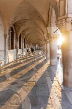 Sun shining in portico at Doge's Palace, St. Mark's Square, Venice, Veneto, Italy
