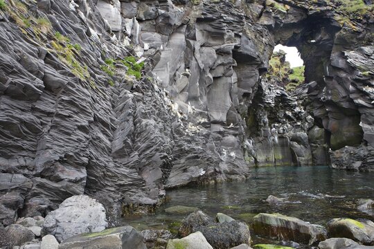 Rock gate (rock window) at the coast near Hellnar, Snaefellsness Peninsula, Iceland, Atlantic Ocean