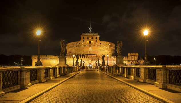 Mausoleum of Hadrian or Castel Sant'Angelo and Ponte Sant'Angelo at night, Rome, Lazio, Italy
