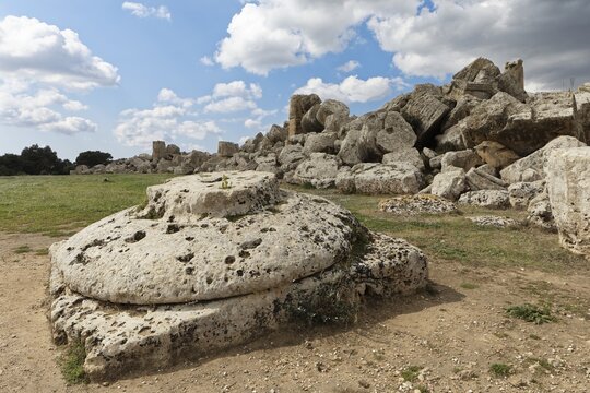 Very large base or capital in front, Doric column, in the back debris from Temple G, presumably dedicated to Zeus, archaeological sites of Selinunte, Parco Archeologico di Selinunte, Castelvetrano, Trapani community consortium, Sicily, Italy, Mediterranean