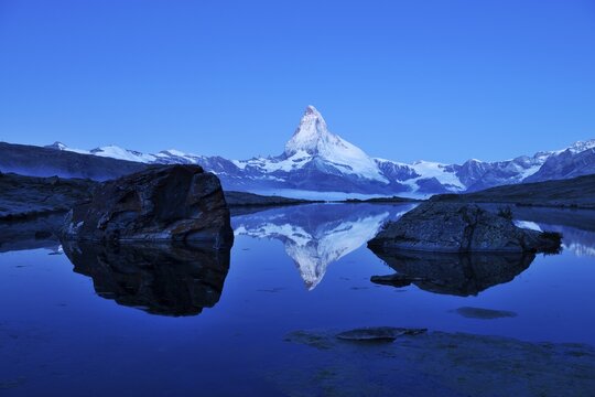 Mt Matterhorn reflected in Stellisee Lake at dusk, Zermatt, Canton of Valais, Switzerland